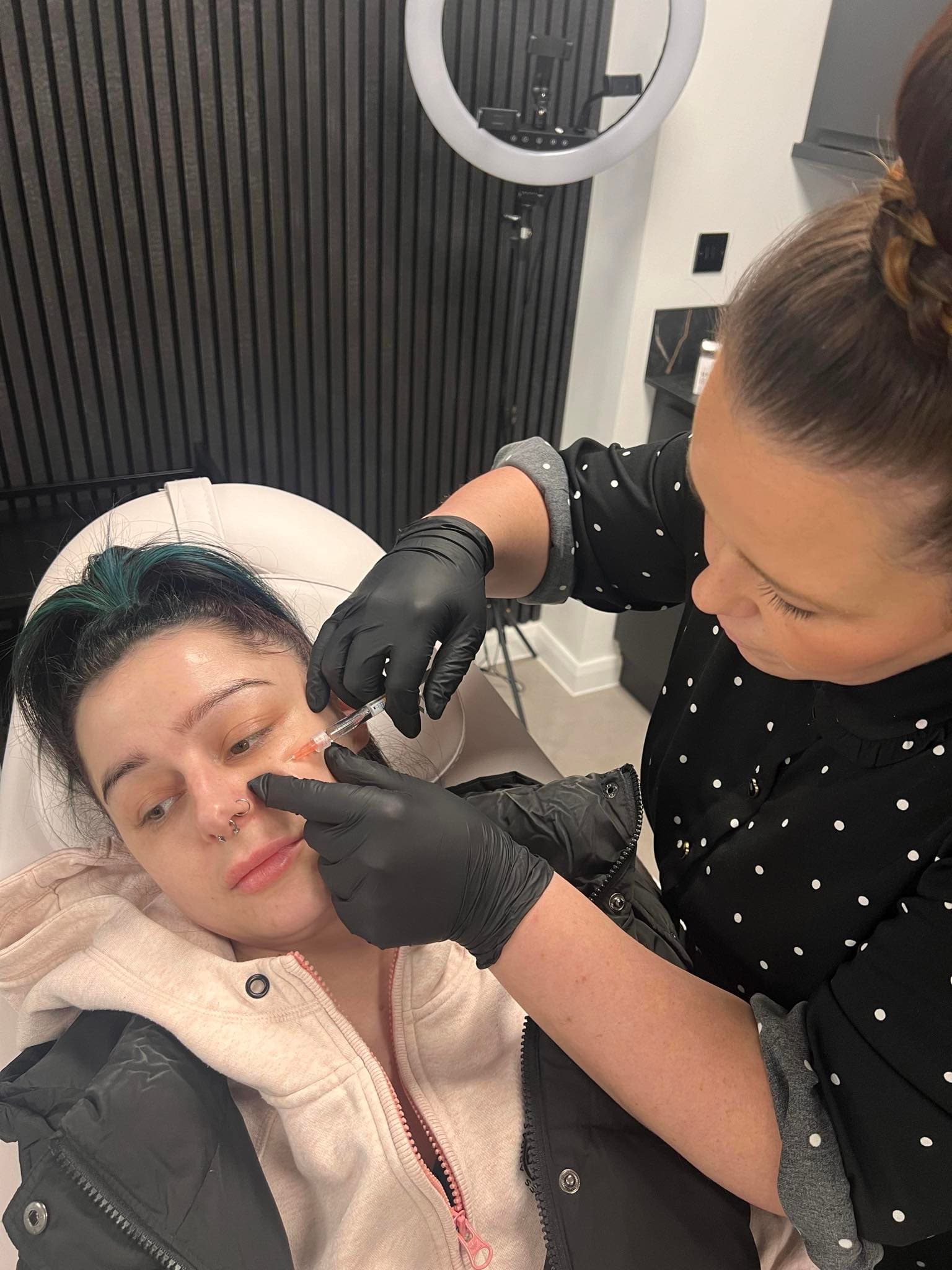 Jody providing an aesthetic treatment